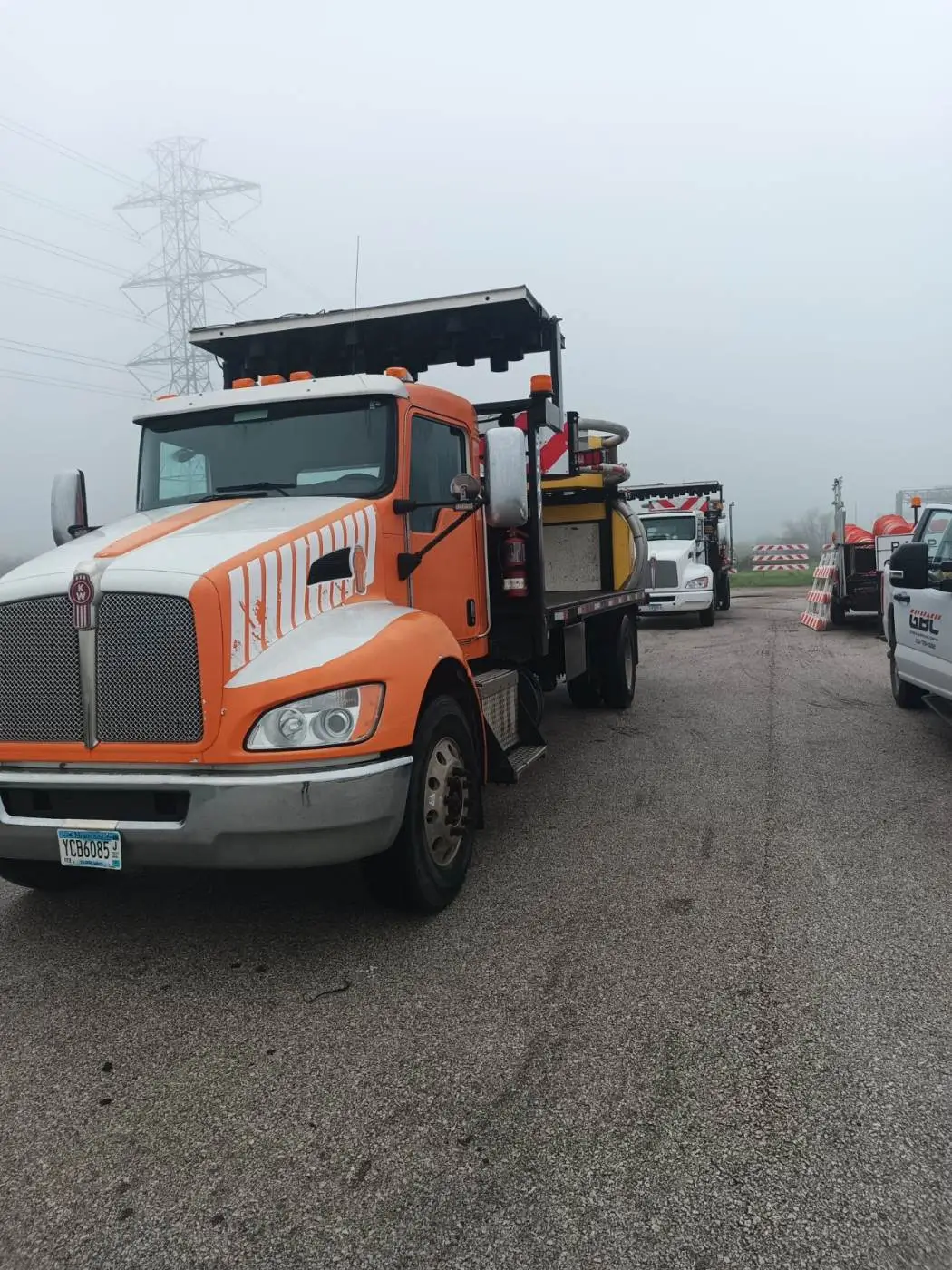 GBC arrow-board and barricade trucks staged for a morning deployment